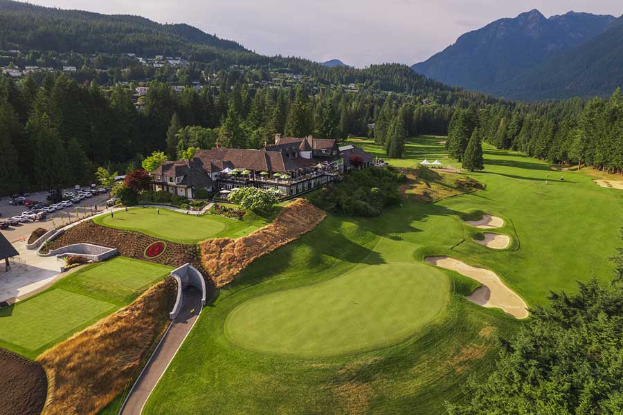 aerial shot of a golf course club house in the mountains
